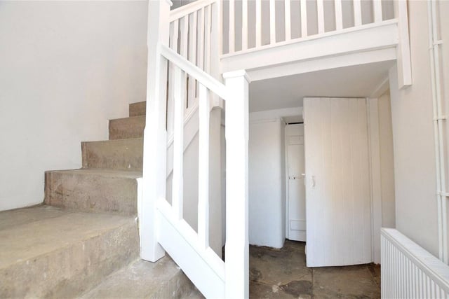 A second staircase towards the back of the property provides access to an additional bedroom.