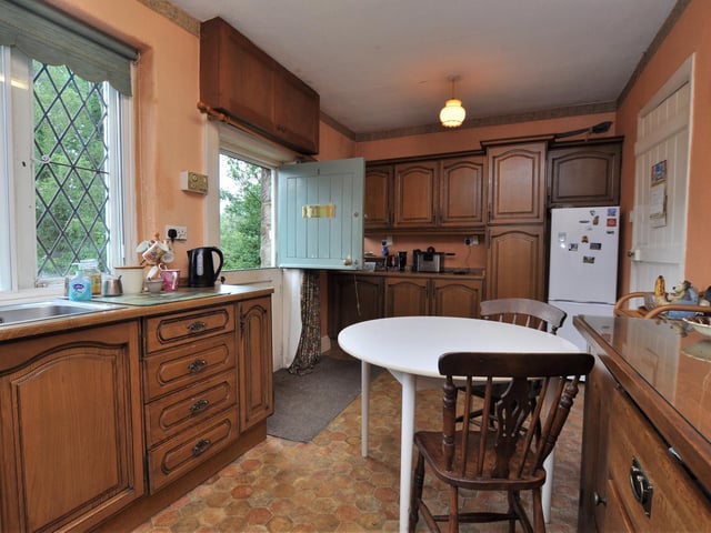 A welcoming kitchen with plenty of storage space within fitted units.