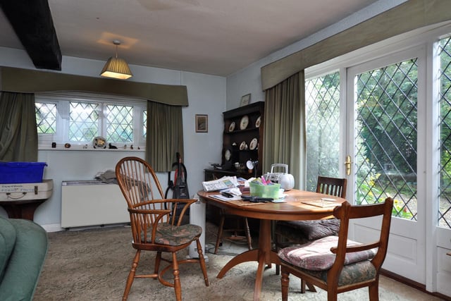 A dining area with views out over the lovely gardens.