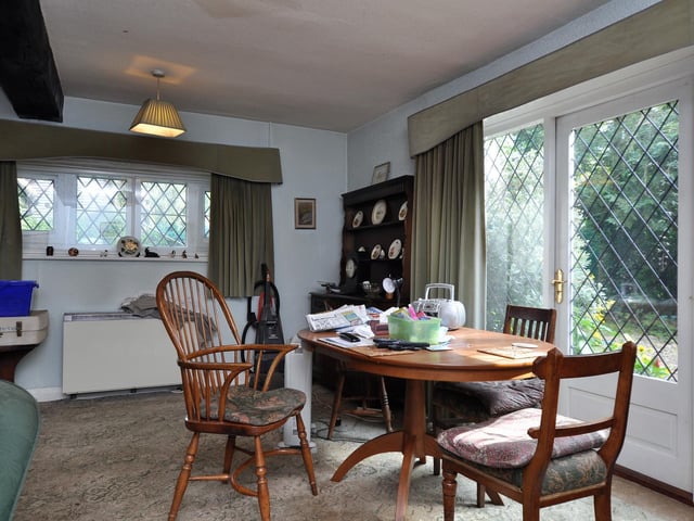 A dining area with views out over the lovely gardens.