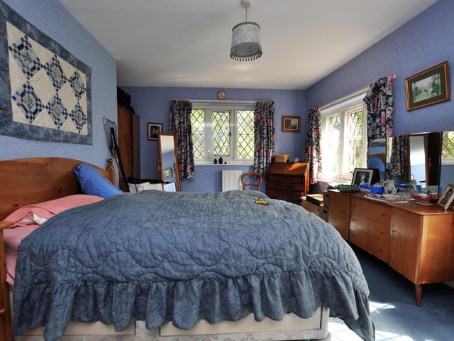 A double bedroom within the house has plenty of natural light.
