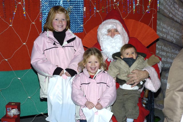 Children visit Santa’s Grotto at the Tourist Information Centre, in aid of the RNLI.