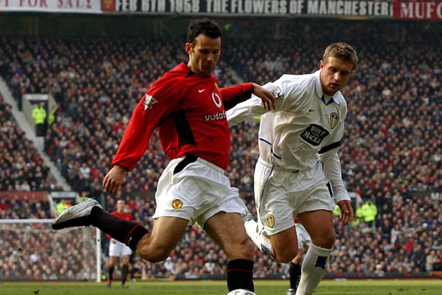 Stephen McPahil closes down Manchester United's Ryan Giggs during the Premiership clash at Old Trafford in February 2004.