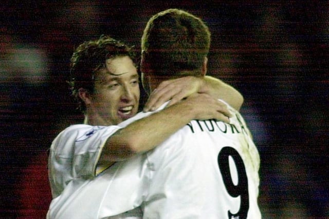 Robbie Fowler congratulates Mark Viduka after the Aussie opened the scoring.