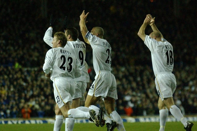 Goalscorer Mark Viduka and Leeds United players look up toward the gantry to salute Lee Bowyer who was watching from the stands. He had been put up for sale after refusing to pay a fine.
