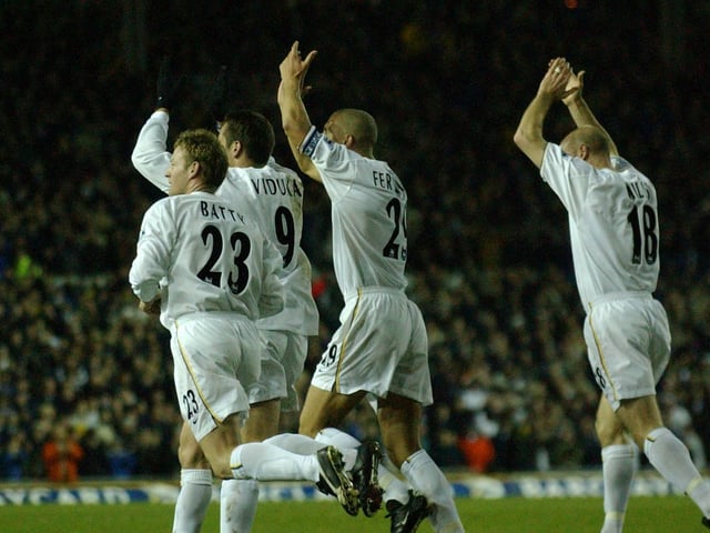 Goalscorer Mark Viduka and Leeds United players look up toward the gantry to salute Lee Bowyer who was watching from the stands. He had been put up for sale after refusing to pay a fine.