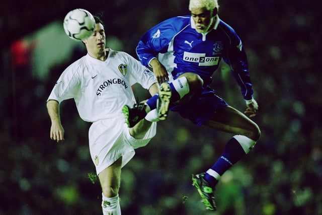 Robbie Fowler is challenged by Everton's Abel Xavier.