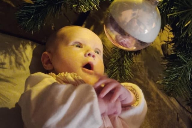 Hayley Louise Edwards shared a photo of Alma seeing baubles for the first time.