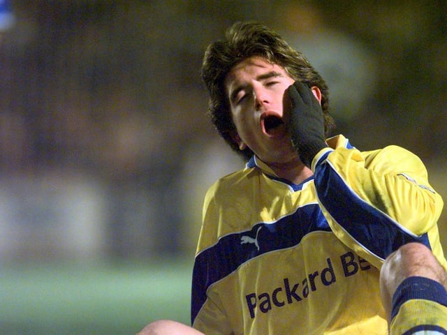 Harry Kewell takes a tumble holding his jaw
