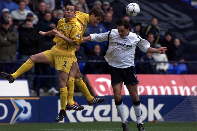 Gary Kelly and Jonathan Woodgate go up for a header with Bolton Wanderers striker Dean Holdsworth.