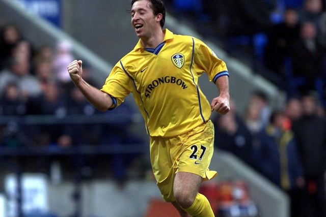 Robbie Fowler celebrates completing his hat-trick.