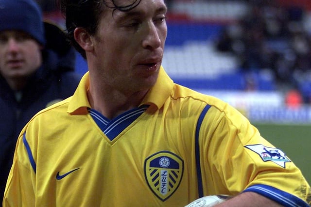 Robbie Fowler keeps hold of the match ball at full-time.