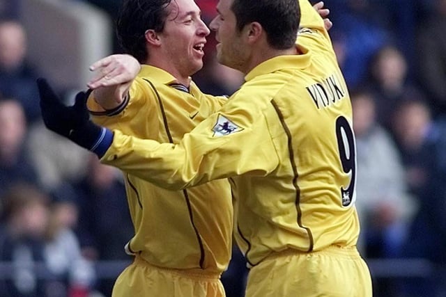 Mark Viduka congratulates Robbie Fowler after the £11 million striker scored his second goal of the game.