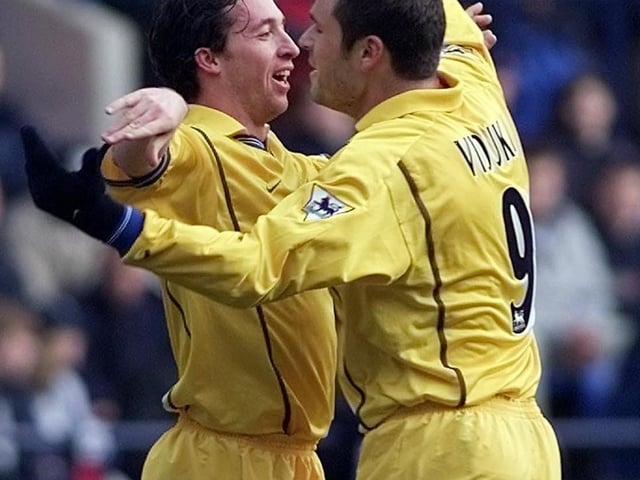 Mark Viduka congratulates Robbie Fowler after the £11 million striker scored his second goal of the game.