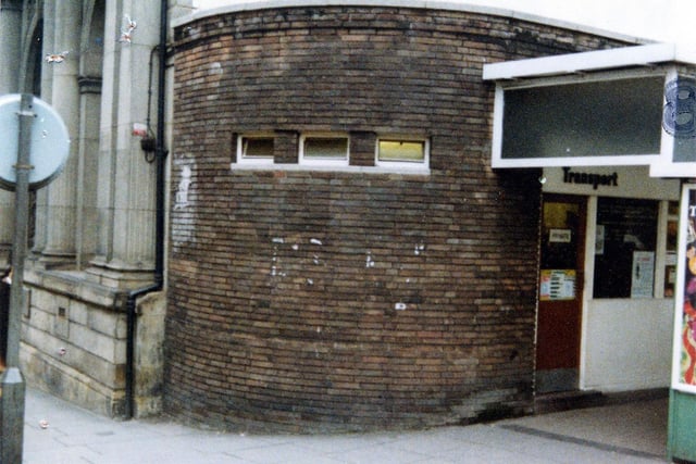 West Yorkshire Passenger Transport Executive's Transport Information Office on the corner of Kirkgate and New Market Street, a round brick building in front of the Trustee Savings Bank. This photo was taken in December 1979.