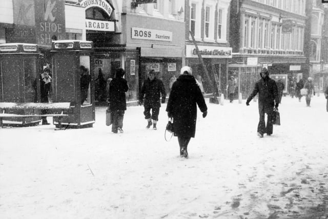 Pedestrians struggle through a snow blizzard in the Leeds city centre in February 1979.