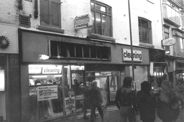 Crockatt Cleaners on Commercial Street in January 1979. The shop sign has been removed and a planning application made for a new one. The next shop along is Silvio's cakes.