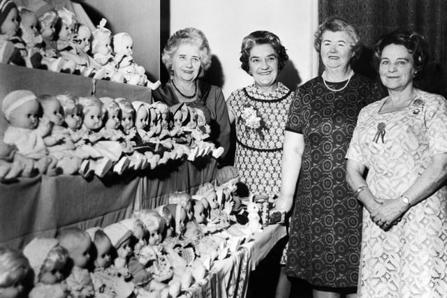 Horsforth Townswomen's Guild bought and dressed a consignment of dolls for the Christmas Fund in December 1968. Pictured are four of the Guild's officers, from left, Mrs. D. Midgley (ex-president), Mrs. M. Laurie (president), Mrs. L. Allen (immediate past chair) and Mrs. M. Dibb (chair).