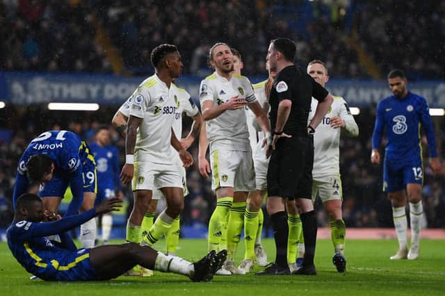 LATE PAIN: Whites captain Luke Ayling leads the remonstrating with referee Chris Kavanagh after Chelsea are awarded a stoppage time penalty for Mateusz Klich's tackle on Antonio Rudiger, left. Photo by Mike Hewitt/Getty Images.