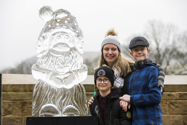 Light up the Valley event at Mytholmroyd. Jacob, eight, Harry, 11, and mum Felicity Boggis, look at one of the ice sculptures by Sand in Your Eye.