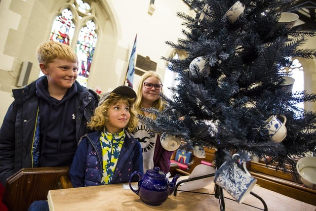 Mytholmroyd Christmas Tree Festival at St Michael's Parish Church. From the left, Matthew Thwaites, 11, Grace Thwaites, six, and Sophie Thwaites, 11.