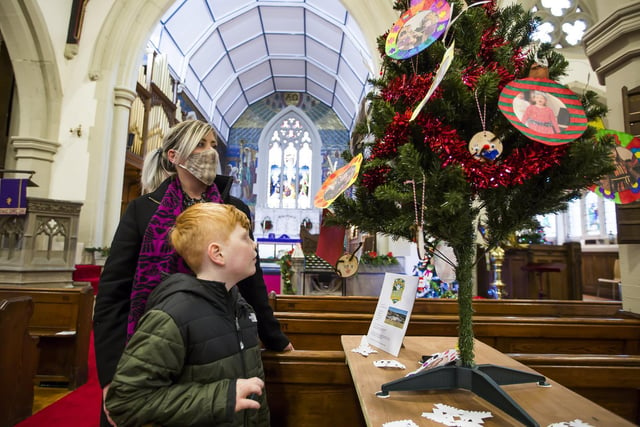 Mytholmroyd Christmas Tree Festival at St Michael's Parish Church. Sarah Workman with son Dylan, seven.
