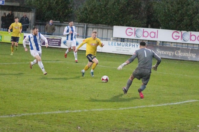 Jordan Porter comes out to make life hard for this Tadcaster Albion attacker. Picture: Keith Handley
