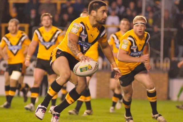 Rangi Chase and Oliver Holmes lead a Castleford Tigers attack in the 2012 kit.
