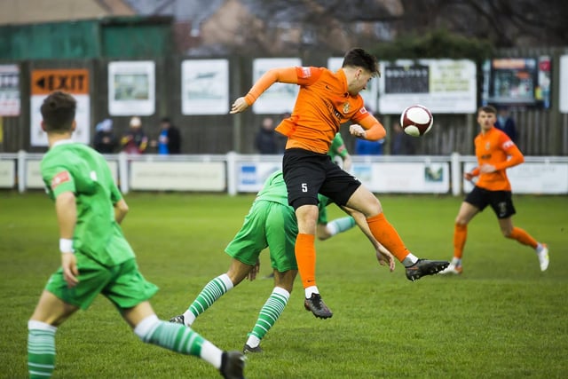 Harrison Beeden aims to head the ball in Brighouse Town's home game with Frickley Athletic when Laurence  Sorhaindo netted a hat-trick in their 3-1 win. Picture: Jim Fitton