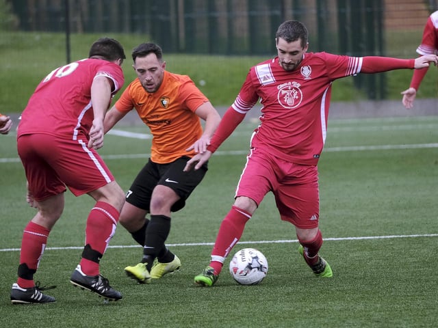 Newlands' Kile Fields holds off Edgehill's Joel Ramm in the Scarborough Saturday League first division clash.
Photos by Richard Ponter