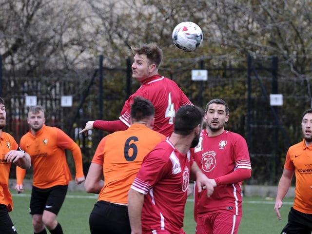 Newlands midfielder Ben Luntley, who impressed throughout the match, wins a header in the Scarborough Saturday League first division 3-1 win at Edgehill.
Photos by Richard Ponter