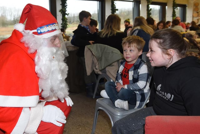 Santa asks children what they would like for Christmas.