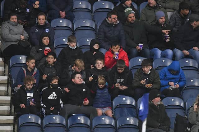 A group of young North End fans get ready to watch the game against Barnsley at Deepdale.