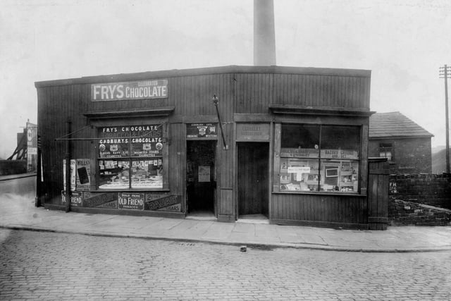 Two retail premises on Botany Bay Place at the junction of Canal Road in April 1923. The premises on the right is Charles Coakley hairdresser and on the left is Moran Valentine Confectioners.
