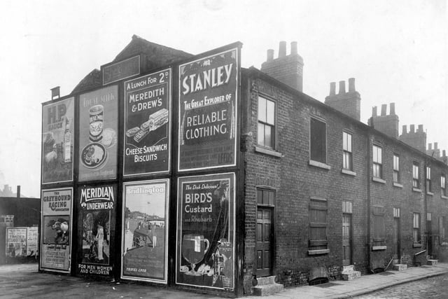 April 1928 and in focus is a row of derelict houses on Concord Street featuring a property whose gable end has several advertising signs. They would all be demolished in the 1930s and in 1952 Leylands Road would be built on the site, running at right angles to Concord Street.