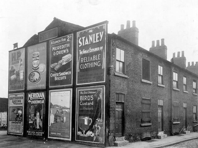 April 1928 and in focus is a row of derelict houses on Concord Street featuring a property whose gable end has several advertising signs. They would all be demolished in the 1930s and in 1952 Leylands Road would be built on the site, running at right angles to Concord Street.
