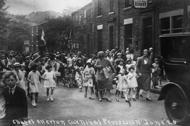 June 1920 and pictured is a section of Chapel Allerton Carnival procession passing the Regent Inn on Regent Street. This part of the parade has children in fancy dress, shepherded along by ladies dressed in the fashion of the period.