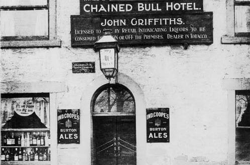 The entrance to the Chained Bull Hotel on Harrogate Road in February 1925. John Griffiths is named as the licensee and Ind Coope & Co. Ltd are the proprietors. A new Chained Bull hotel was in the process of being built at the time, just behind this one, leaving this building dating from the 18th century to close and subsequently be demolished.