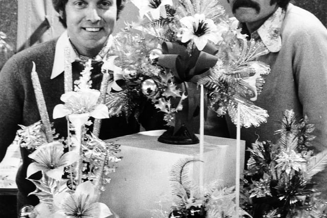 Harrogate, 18th November 1974  Demonstrating some of their Christmas arrangements are florists Eric (left) and Edward, of Eric Nunns, Ltd.