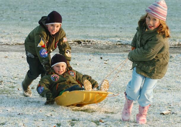 28 December 2005. Christmas holiday fun in the snow on the Stray in Harrogate. Pictured, from left, Will Leventhal, 8, with brother Robbie, 6, and sister Rebecca, 10, from Harrogate.