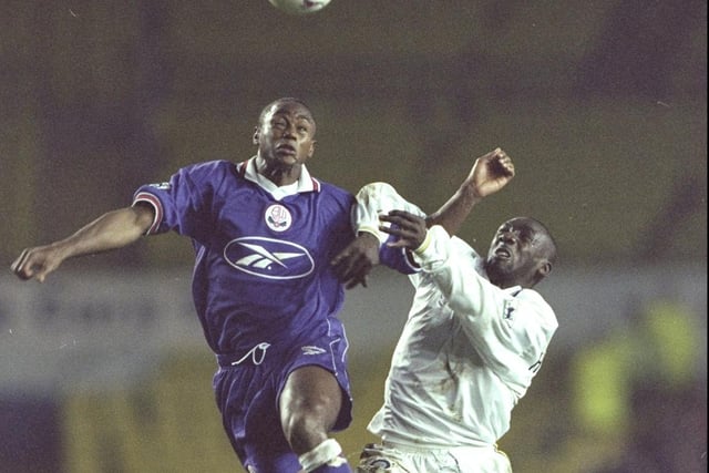 Jimmy Floyd-Hasselbaink battles for the ball with former Whiutes defender Chris Fairclough during Leeds United's Premier Leaghue clash against Bolton Wanderers at Elland Road in December 1997.