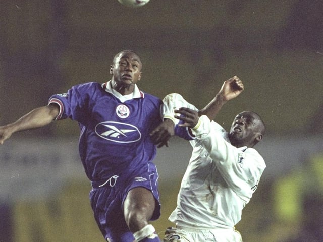 Jimmy Floyd-Hasselbaink battles for the ball with former Whiutes defender Chris Fairclough during Leeds United's Premier Leaghue clash against Bolton Wanderers at Elland Road in December 1997.