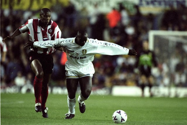 Jimmy Floyd-Hasselbaink holds off Southampton's Carlton Palmer during the Premiership clash at Elland Road in September 1998. Leeds won 3-0.
