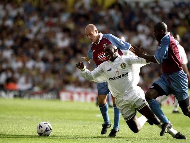 Jimmy Floyd-Hasselbaink is brought down by Aston Villa's Ian Taylor (right) as Alan Wright watches on during the Premiership clash at Elland Road in September 1998. The game finished goalless.