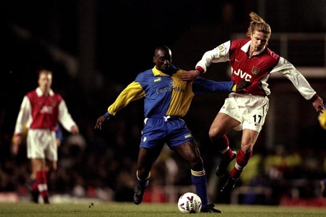 Jimmy-Floyd Hasselbaink is challenged by Arsenal's Emmanuel Petit during the Premiership clash at Highbury in December 1998. The Gunners won 3-1.
