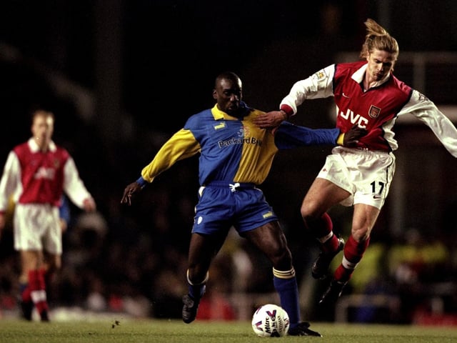 Jimmy-Floyd Hasselbaink is challenged by Arsenal's Emmanuel Petit during the Premiership clash at Highbury in December 1998. The Gunners won 3-1.