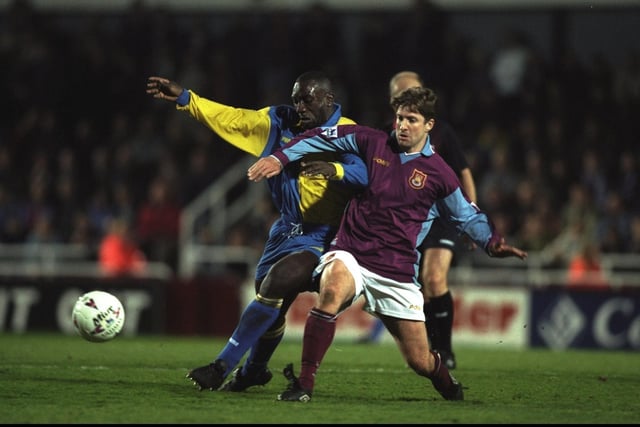 Jimmy-Floyd Hasselbaink takes on West Ham United's John Moncur during the  Premiership clash at Upton Park in March 1998. The Hammers won 3-0.