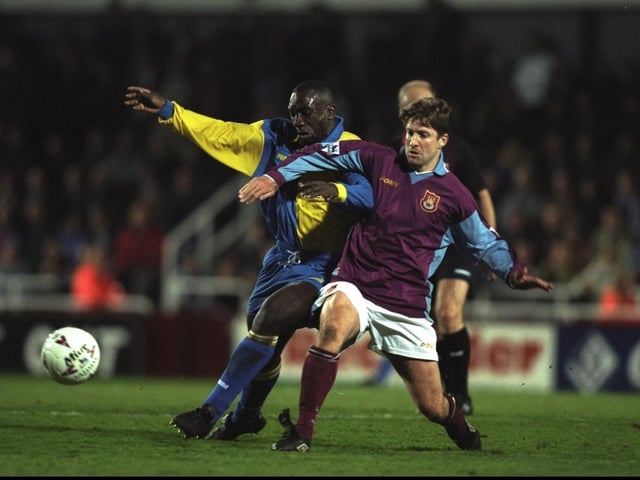 Jimmy-Floyd Hasselbaink takes on West Ham United's John Moncur during the  Premiership clash at Upton Park in March 1998. The Hammers won 3-0.