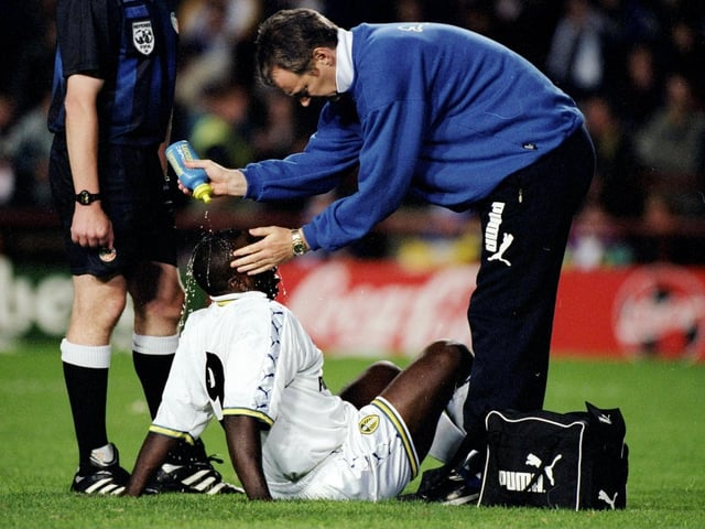 Jimmy Floyd-Hasselbaink receives treatment during a pre-season game against Lazio in Dublin in July 1998.