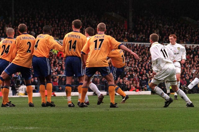 Jimmy Floyd-Hasselbaink bends the ball around Derby County's wall to score from a free kick during the Premiership clash at Elland Road in March 1999. PIC: John Giles/PA